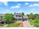 Charming two-story home with a welcoming front porch, a well-kept lawn, and an attached garage at 18967 W 54Th Ln, Golden, CO 80403
