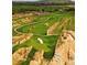 Picturesque golf course featuring well-manicured greens, sand traps, and natural rock formations, offering a challenging play at 18967 W 54Th Ln, Golden, CO 80403