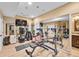 Bright home gym features lots of equipment, mirrors, and neutral flooring at 18967 W 54Th Ln, Golden, CO 80403