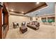 Spacious living area with carpeted floor, coffered ceiling, and large windows at 18967 W 54Th Ln, Golden, CO 80403