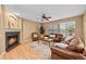 Comfortable living room with a fireplace, plush seating, and a neutral color palette for a relaxing atmosphere at 18967 W 54Th Ln, Golden, CO 80403