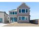 View of house from the backyard, some snow on the ground at 13264 Blue Amber Ct, Parker, CO 80134