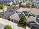 Stunning aerial view showcases a neighborhood with solar panels and well-maintained landscaping at 5445 Verbena St, Denver, CO 80238