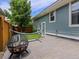Cozy backyard with a fire pit and a hammock for outdoor enjoyment at 5445 Verbena St, Denver, CO 80238