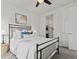 Bright bedroom with plush carpeting, ensuite bathroom, and a large window at 5445 Verbena St, Denver, CO 80238