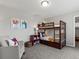 Cozy bedroom with a bunk bed and soft chair at 5445 Verbena St, Denver, CO 80238