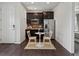 Bright kitchen features stainless steel appliances, granite countertop and eating space at 5445 Verbena St, Denver, CO 80238