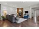 Stylish living room with a stone fireplace, plush seating, and warm lighting at 5445 Verbena St, Denver, CO 80238