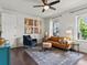 Well-lit living room with hardwood floors, modern furniture and stylish decor at 5445 Verbena St, Denver, CO 80238