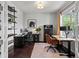 Well-lit home office with modern decor, dual workstations, and ample natural light at 5445 Verbena St, Denver, CO 80238