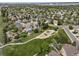 Desirable community aerial featuring a playground with lush landscaping, a walking path, and mature trees at 9548 La Quinta Dr, Lone Tree, CO 80124
