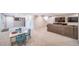 Large basement area with a sofa, TV, and a table and chairs at 9548 La Quinta Dr, Lone Tree, CO 80124