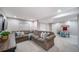 Spacious basement with a comfortable sectional couch and a play area with a table and chairs at 9548 La Quinta Dr, Lone Tree, CO 80124