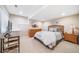 Finished bedroom with neutral color palette and comfortable furniture at 9548 La Quinta Dr, Lone Tree, CO 80124