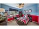 This fun bedroom features creative colors, a ceiling fan, and a large window to allow in lots of natural light at 9548 La Quinta Dr, Lone Tree, CO 80124