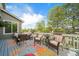 Back deck featuring outdoor furniture and sunny views of the neighborhood at 9548 La Quinta Dr, Lone Tree, CO 80124