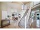 Inviting entryway with staircase, natural light, and stylish decor at 9548 La Quinta Dr, Lone Tree, CO 80124