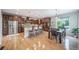 Spacious kitchen featuring custom wood cabinets, a large island, and stainless steel appliances at 9548 La Quinta Dr, Lone Tree, CO 80124