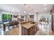 Open floor plan kitchen featuring granite counters, island, hardwood floors at 9548 La Quinta Dr, Lone Tree, CO 80124