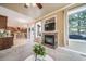 Inviting living room with fireplace, adjacent to gourmet kitchen at 9548 La Quinta Dr, Lone Tree, CO 80124