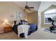 Serene main bedroom with vaulted ceiling, large window, and a ceiling fan at 9548 La Quinta Dr, Lone Tree, CO 80124