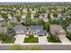Street view featuring a meticulously maintained yard and three-car garage at 9548 La Quinta Dr, Lone Tree, CO 80124