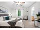 Stylish bedroom with vaulted ceiling, neutral colors, ceiling fan and an ensuite bathroom at 4674 Winona Pl, Broomfield, CO 80020