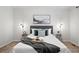 Comfortable bedroom featuring neutral tones, an abstract art piece, and side tables with contemporary lighting at 4674 Winona Pl, Broomfield, CO 80020