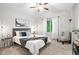 Relaxing bedroom with a ceiling fan, comfortable bed, and natural light from the window at 4674 Winona Pl, Broomfield, CO 80020