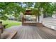 Charming wooden deck with stairs and wooden features amid lush greenery at 4674 Winona Pl, Broomfield, CO 80020