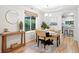 Warm dining area featuring natural light, wood floors and open to the kitchen at 4674 Winona Pl, Broomfield, CO 80020
