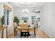 Elegant dining room featuring stylish lighting and a view to the kitchen at 4674 Winona Pl, Broomfield, CO 80020