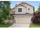 Charming two-story home with a well-maintained lawn and attached two-car garage at 4674 Winona Pl, Broomfield, CO 80020