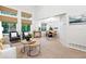 Open-concept living space featuring large windows, natural light, and view to dining room at 4674 Winona Pl, Broomfield, CO 80020
