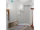 A carpeted stairway features a wooden railing, modern walls and great lighting at 4674 Winona Pl, Broomfield, CO 80020