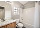 Bathroom with tub, shower, and wood vanity at 19249 E Carolina Dr # 106, Aurora, CO 80017