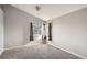 Bedroom with carpet, corner window, and ceiling fan at 19249 E Carolina Dr # 106, Aurora, CO 80017