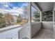 Covered porch overlooking a snowy yard and neighborhood at 19249 E Carolina Dr # 106, Aurora, CO 80017