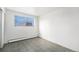 Cozy bedroom featuring a large window and tile flooring, bathed in natural light at 875 S Quebec St # 21, Denver, CO 80247