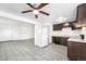 Bright kitchen space with tile flooring, white refrigerator, and adjacent living area at 875 S Quebec St # 21, Denver, CO 80247