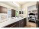 Modern bathroom features sleek vanity with double sinks and a separate shower room at 6500 W Mansfield Ave # 39, Denver, CO 80235