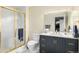 Stylish bathroom featuring a vanity with double sinks and a sleek shower room at 6500 W Mansfield Ave # 39, Denver, CO 80235