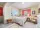 Cozy bedroom with a plush bed, stylish furniture, and a colorful rug at 6500 W Mansfield Ave # 39, Denver, CO 80235
