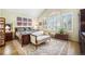 Bright bedroom with a large window, a sitting area, and stylish accents creating a relaxing ambiance at 6500 W Mansfield Ave # 39, Denver, CO 80235