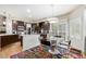 Inviting breakfast nook offering built-in cabinets, stainless steel appliances, and plenty of natural light from large windows at 6500 W Mansfield Ave # 39, Denver, CO 80235