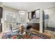 Cozy breakfast nook with stylish seating, modern cabinets, and natural light streaming through shuttered windows at 6500 W Mansfield Ave # 39, Denver, CO 80235