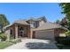 Beautiful home with brick and gray siding, a tile roof, and mature landscaping, perfect for curb appeal at 6500 W Mansfield Ave # 39, Denver, CO 80235