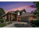 Beautiful home with brick and gray siding, a tile roof, and mature landscaping, perfect for curb appeal at 6500 W Mansfield Ave # 39, Denver, CO 80235