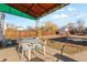 Small backyard patio with table and chairs under covered area at 3230 S Bannock St, Englewood, CO 80110