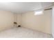 Unfinished basement room with small window at 3230 S Bannock St, Englewood, CO 80110